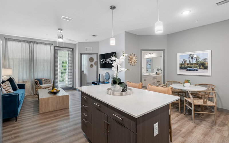 spacious living room kitchen and dining room with wood floor